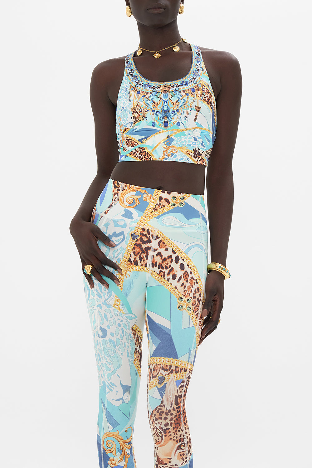 Crop view of model waering CAMILLA activewear crop top in Sky Cheetah print