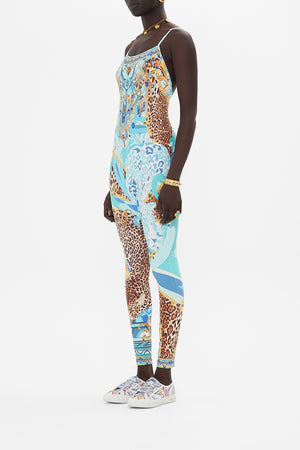 Side view of model wearing CAMILLA designer catsuit in Sky Cheetah print