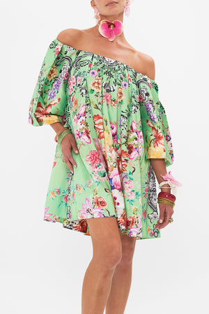 Crop view of model wearing CAMILLA pudd sleeve dress in Porcelain Dream print