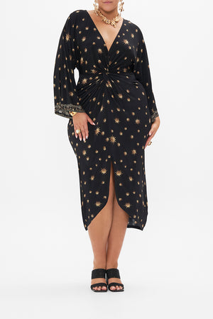 Front view of curvy model wearing CAMILLA plus size  black midi dress in Soul Of A Star Gazer print
