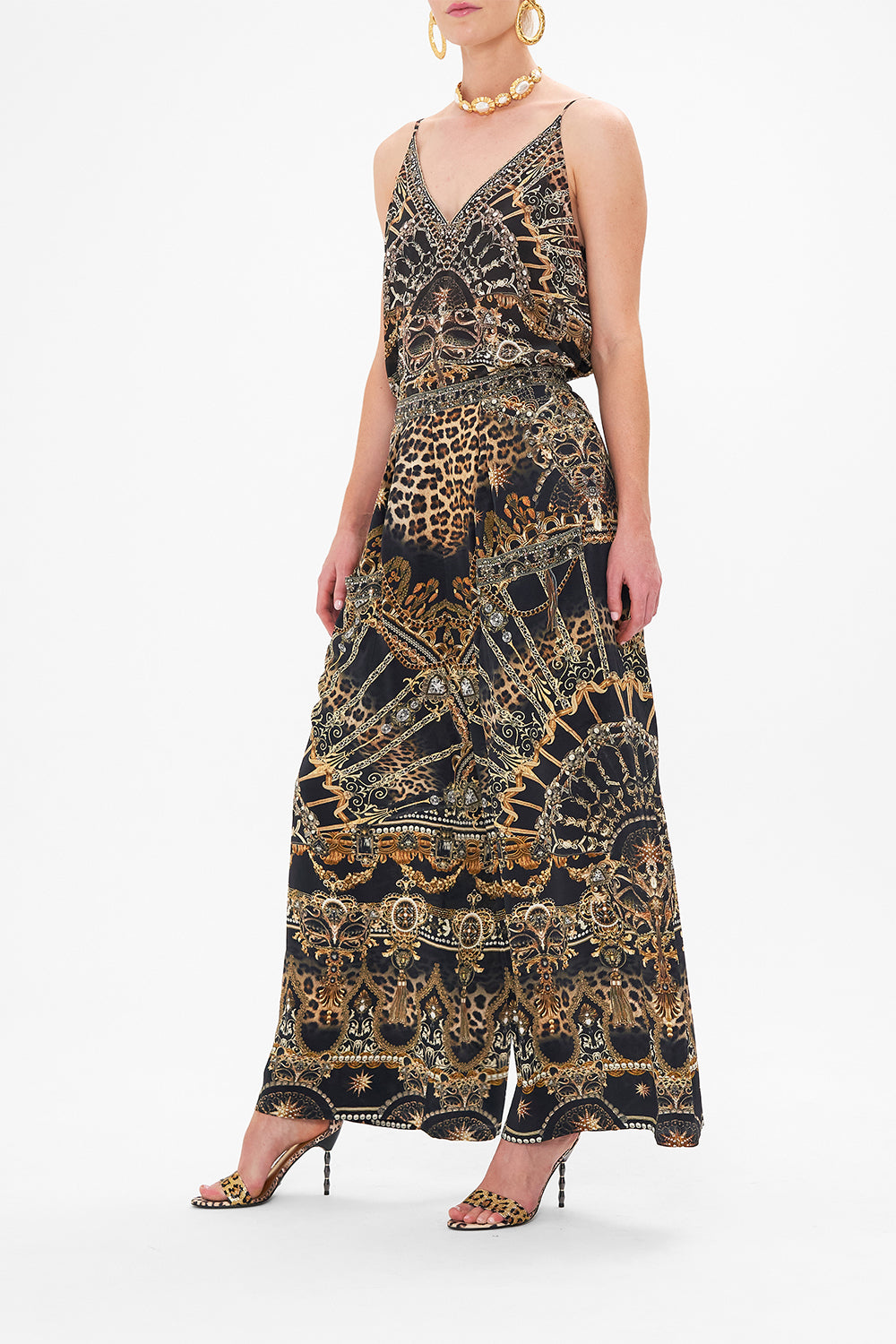 Side view of model wearing CAMILLA silk palazzo pants in Masked At Moonlight print