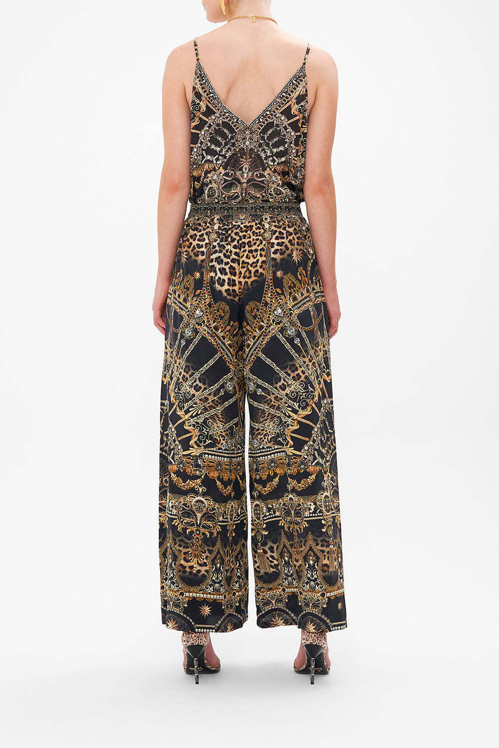 Back view of model wearing CAMILLA silk palazzo pants in Masked At Moonlight print
