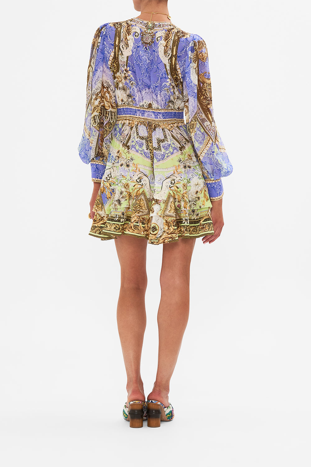 Back view of model wearing CAMILLA silk frill drfess in Guilded Pleasures print 