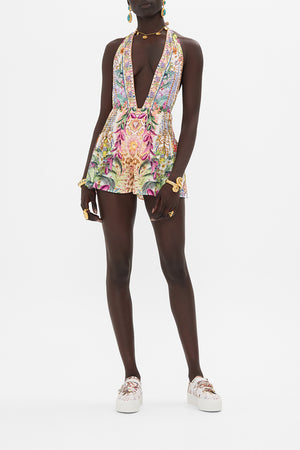 Front view of model wearing CAMILLA floral print silk shorts in Flowers of Neptune print 