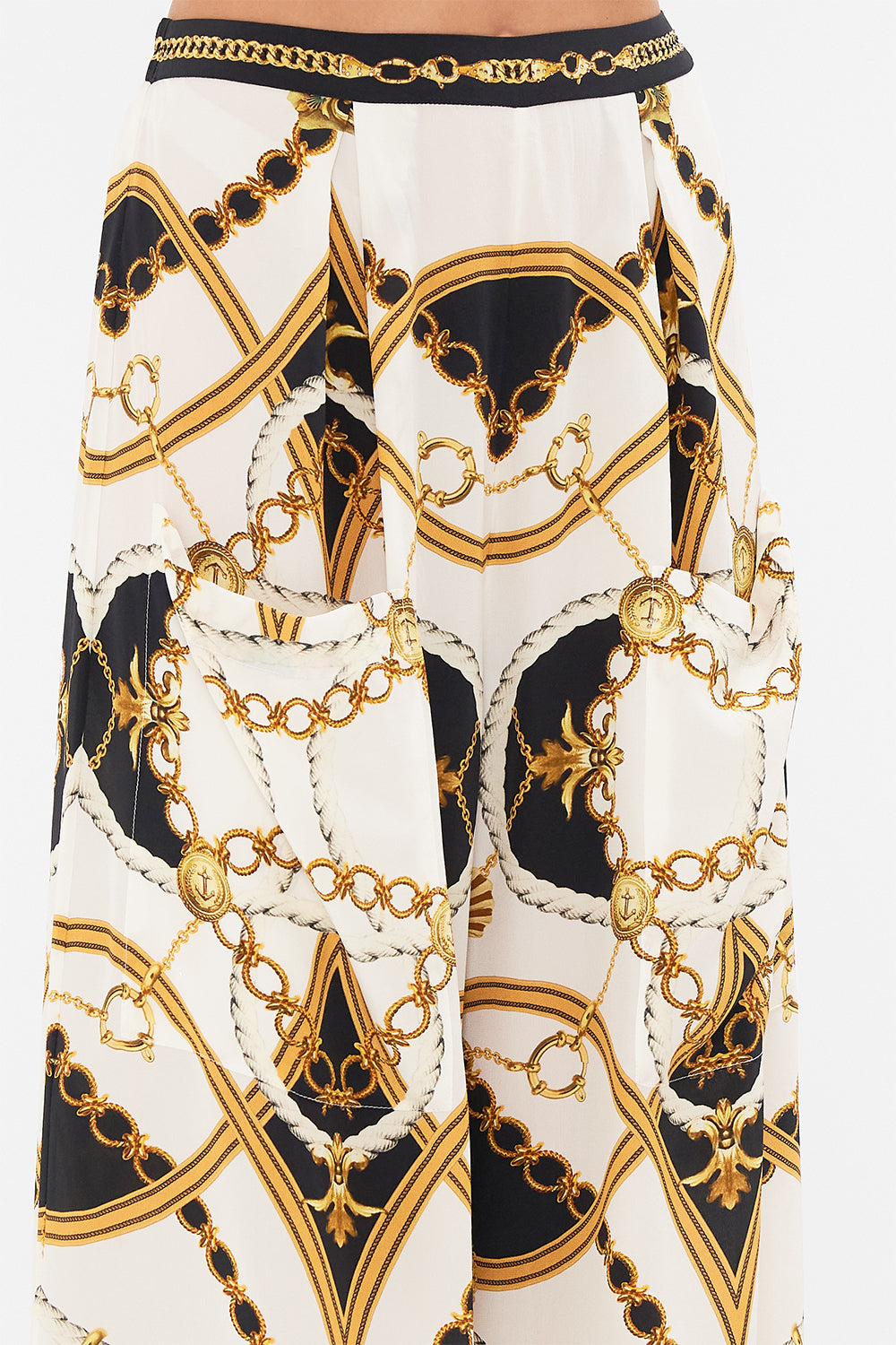 Detail view of model wearing CAMILLA silk palazzo pants in Sea Charm print