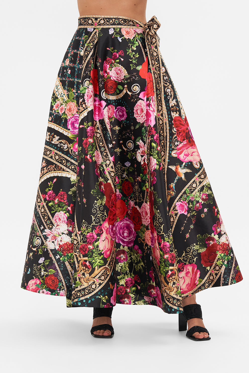 Side view of model wearing CAMILLA designer maxi wrap skirt in Reservation Fot Love print 