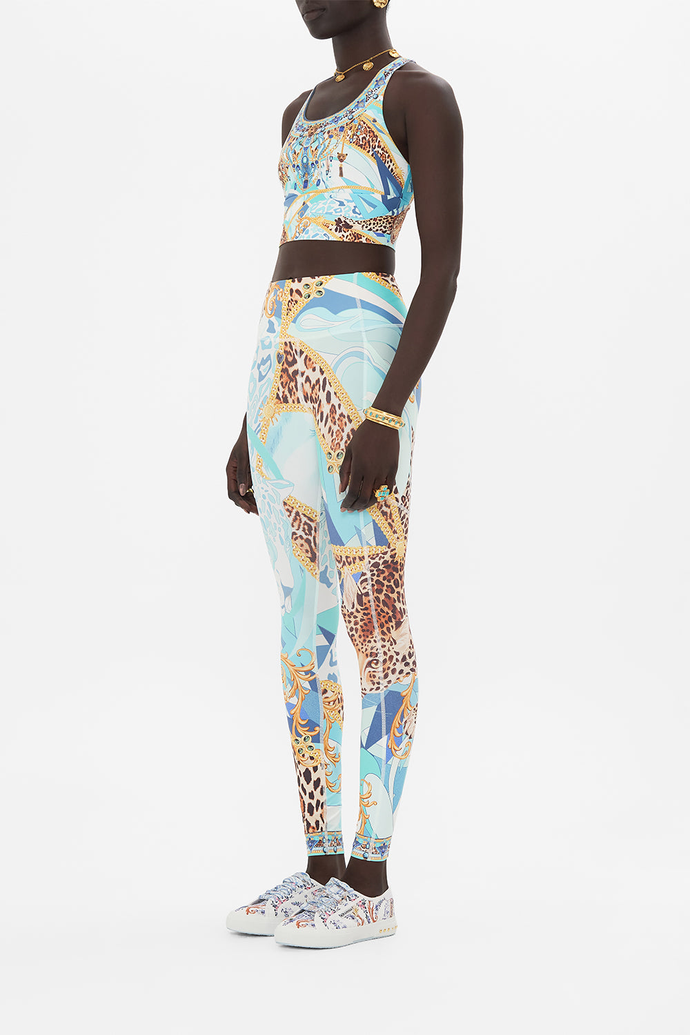 Side view of model wearing CAMILLA activewear legging in Sky Cheetah print