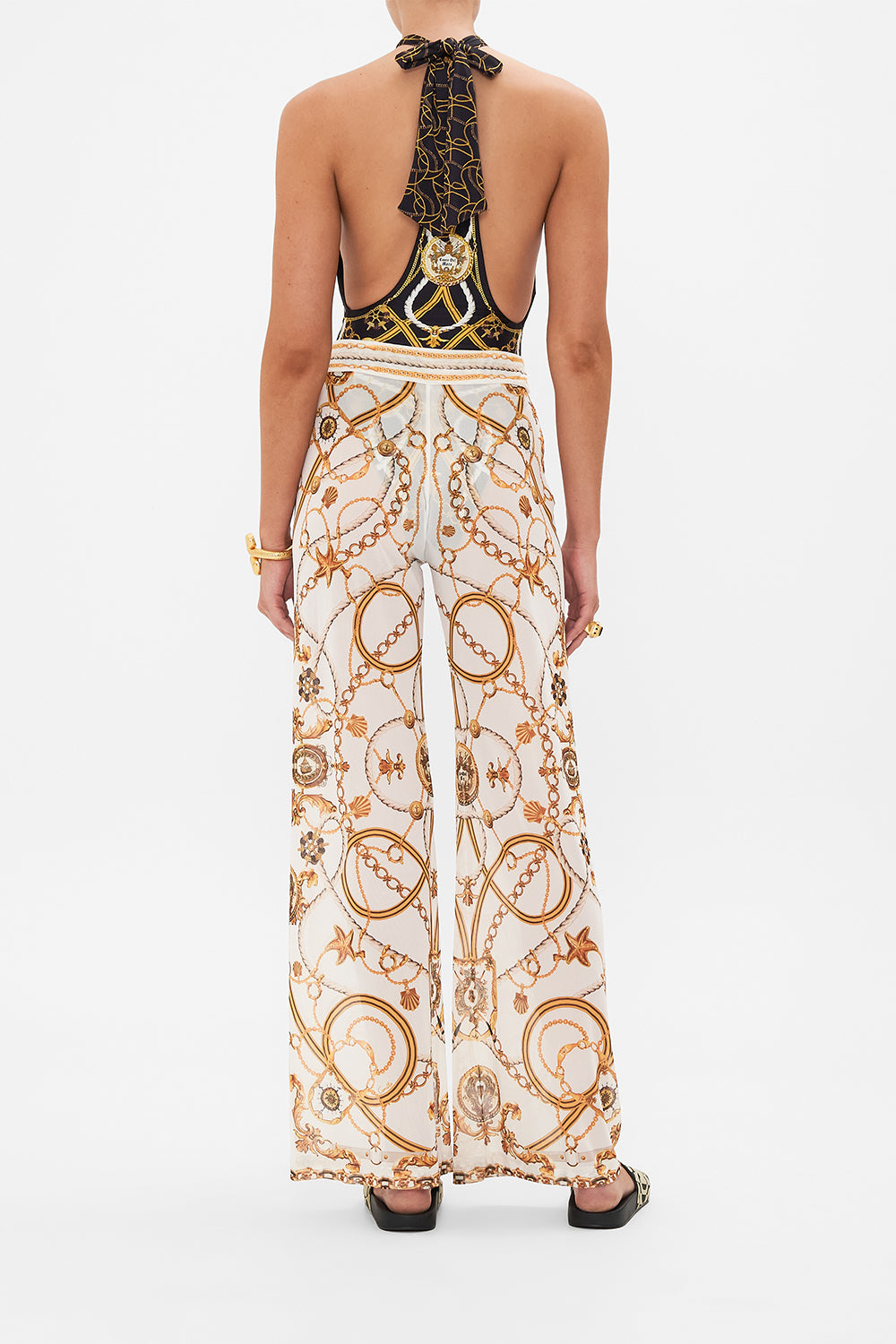 Back view of model wearing CAMILLA sheer mesh pants in Coast To Coast print 