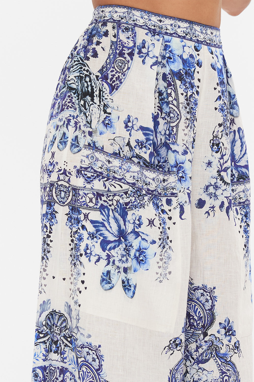 Detail view of model wearing CAMILLA silk trouser in Glaze and Graze print 