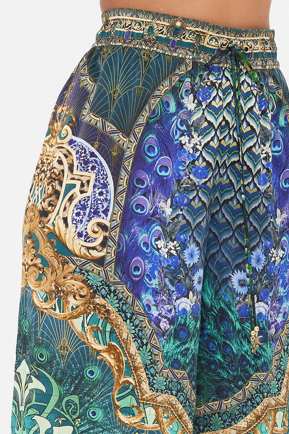 Detail view of model wearing CAMILLA silk pants in Fan Dance print 