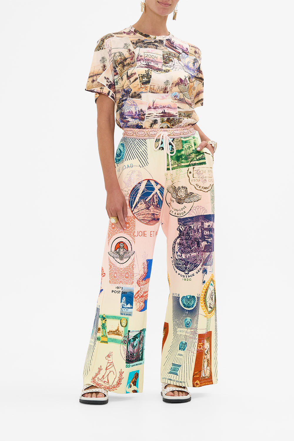 CAMILLA blush straight leg track pant in Haute Passport print. 