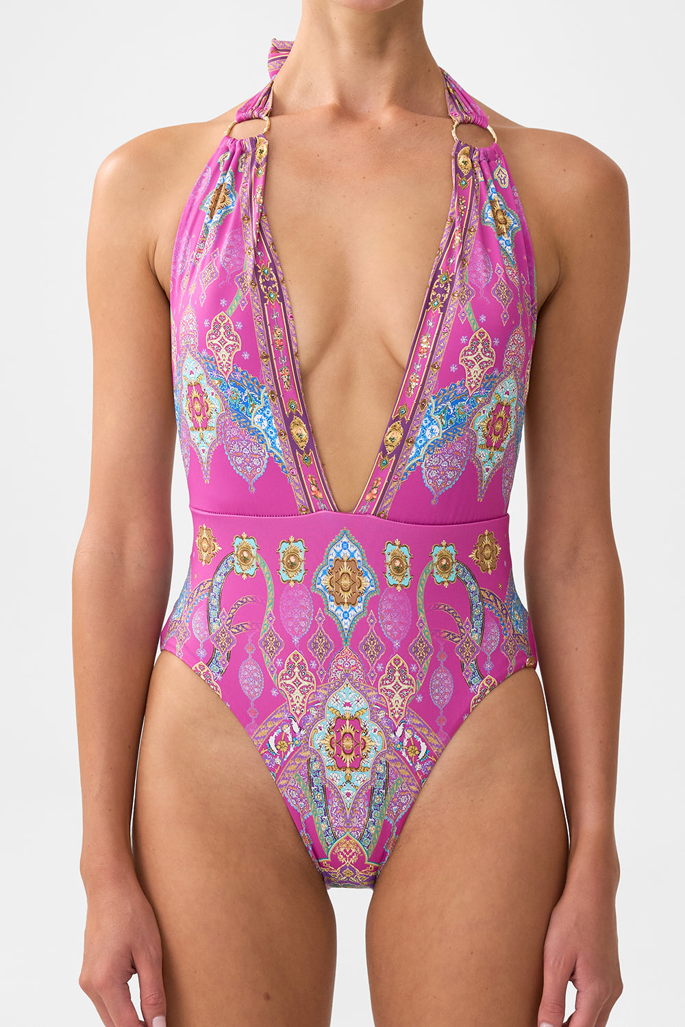 The CAMILLA PLUNGE BACKLESS HALTER ONE PIECE WITH RING TIES CONCUBINES, SULTANS & COURTIERS