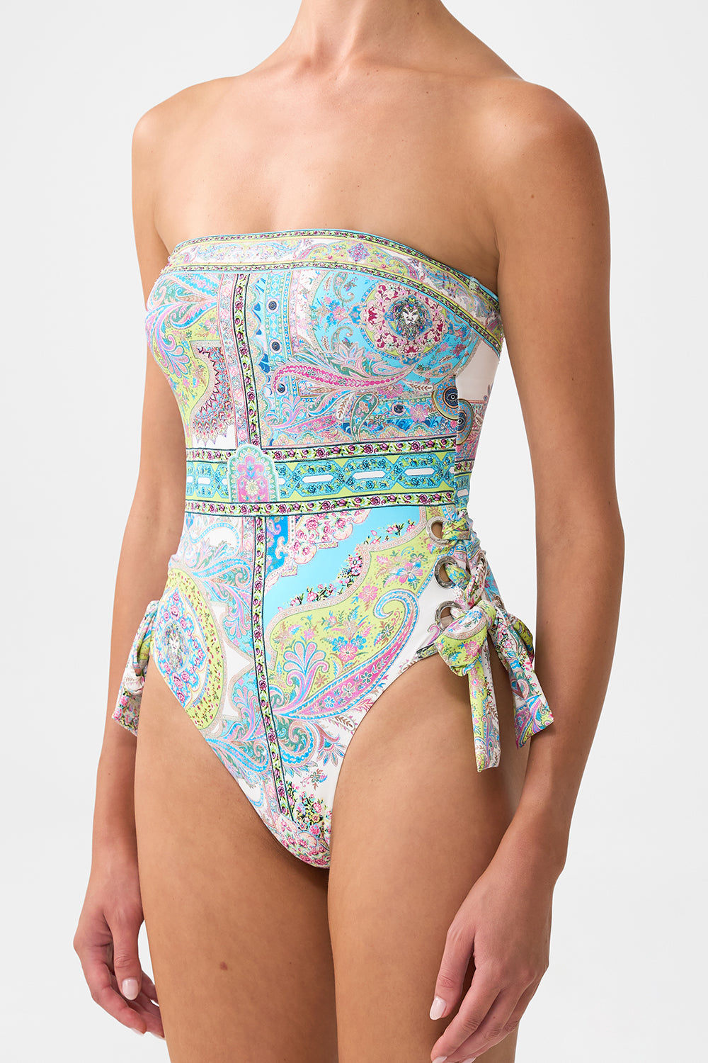 The CAMILLA BANDEAU ONE PIECE WITH EYELET TIE SIDES MAGIC CARPET RIDE