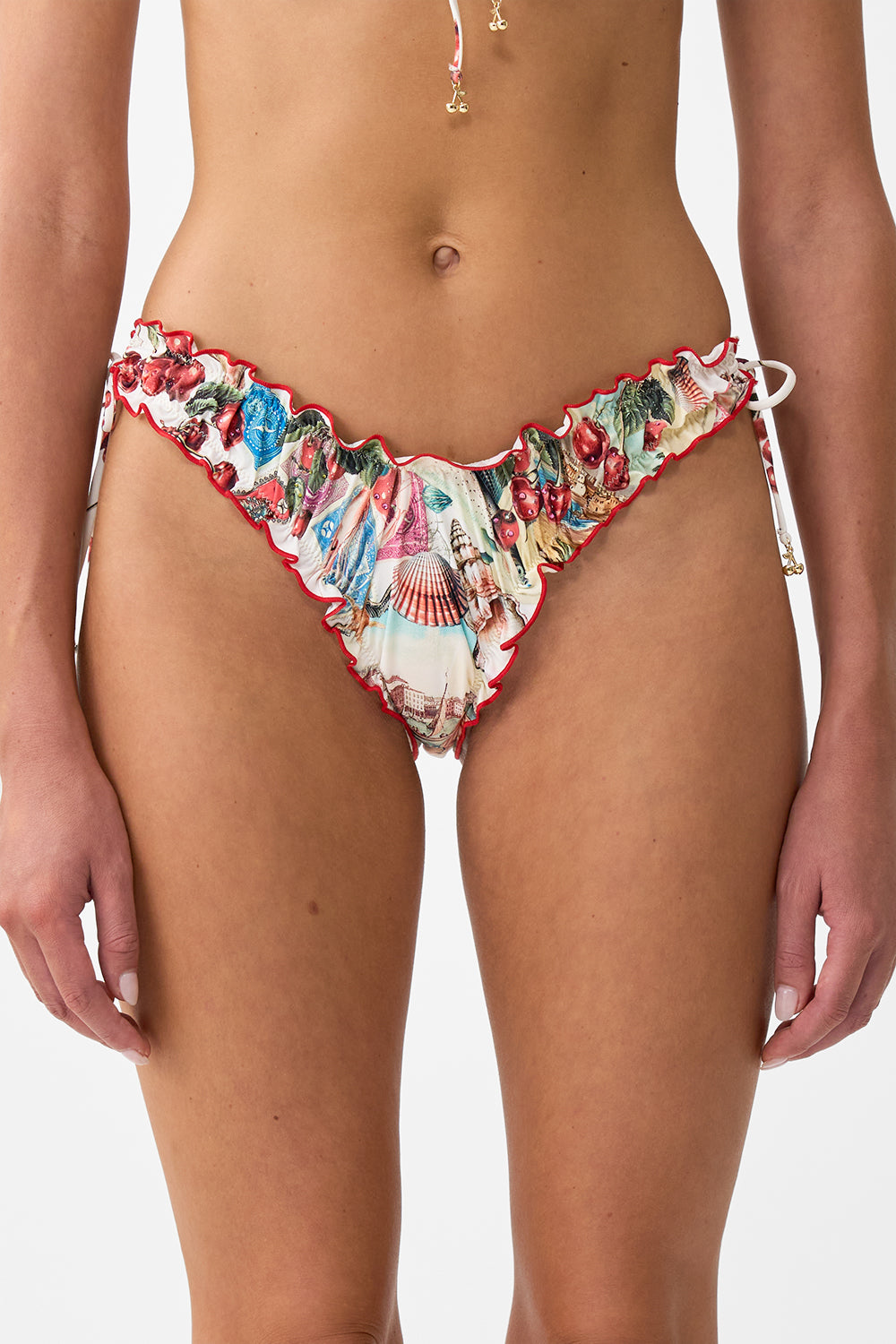 The CAMILLA RUCHED SKIMPY BIKINI BOTTOM WITH TIE SIDES NOTES FROM THE ROAD