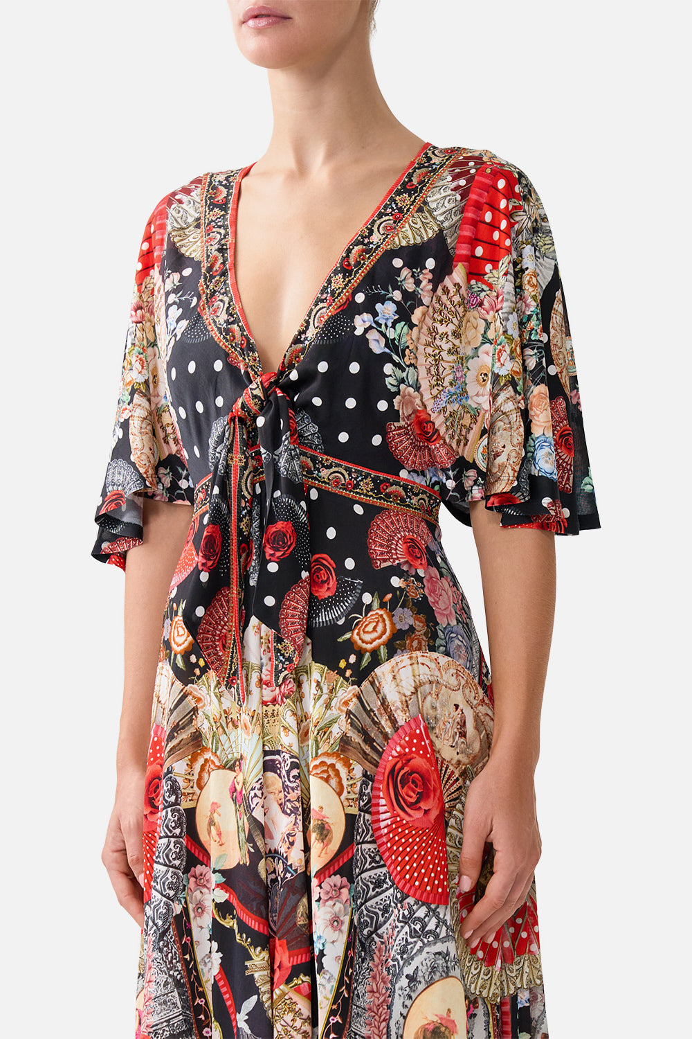 The CAMILLA FLUTTER SLEEVE TIE FRONT JERSEY DRESS DAUGHTERS OF DUENDE