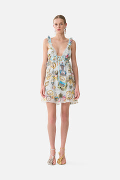 The CAMILLA Curved Hem Ruffle Dress in our Art For The Artisans print.