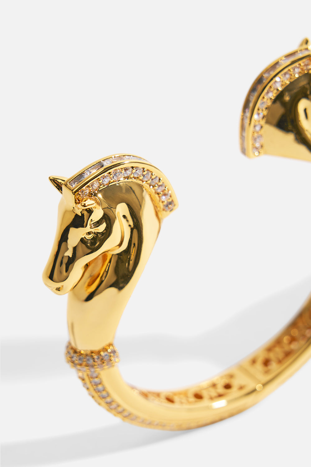 The CAMILLA SAVAGE BEAUTY HORSE BANGLE GOLD