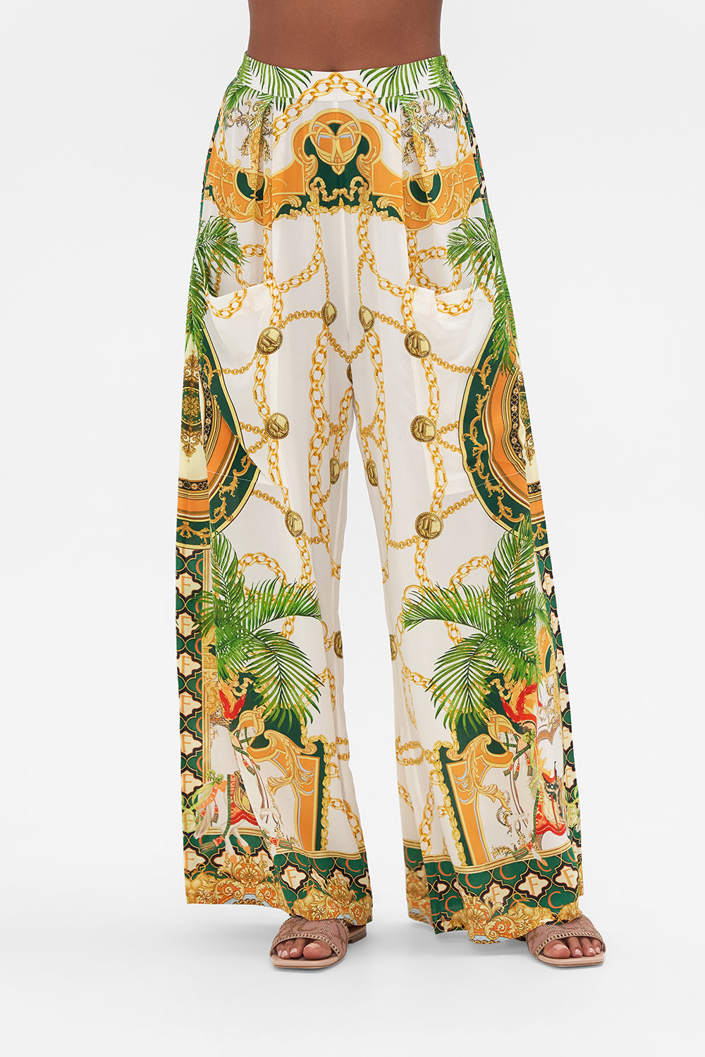 Crop view of model wearing CAMILLA silk pants in My Sweet Devotion print 