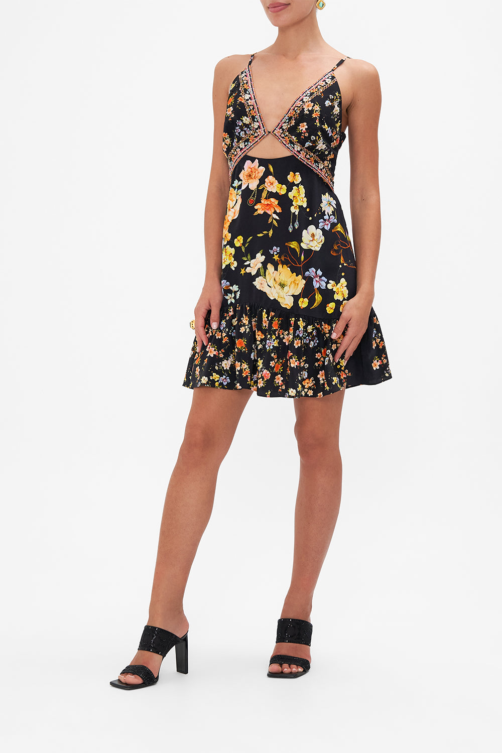 Side view of model wearing CAMILLA floral silk mini dress in Secret History print