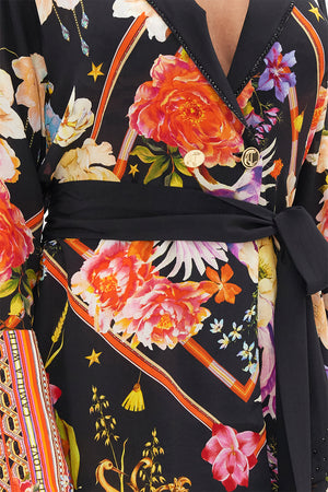 Detail view of model wearing CAMILLA  silk jacket in Secret History floral print