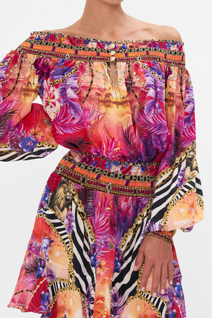 Detail view of model wearing CAMILLA silk off the shoulder dress in Wild Loving print