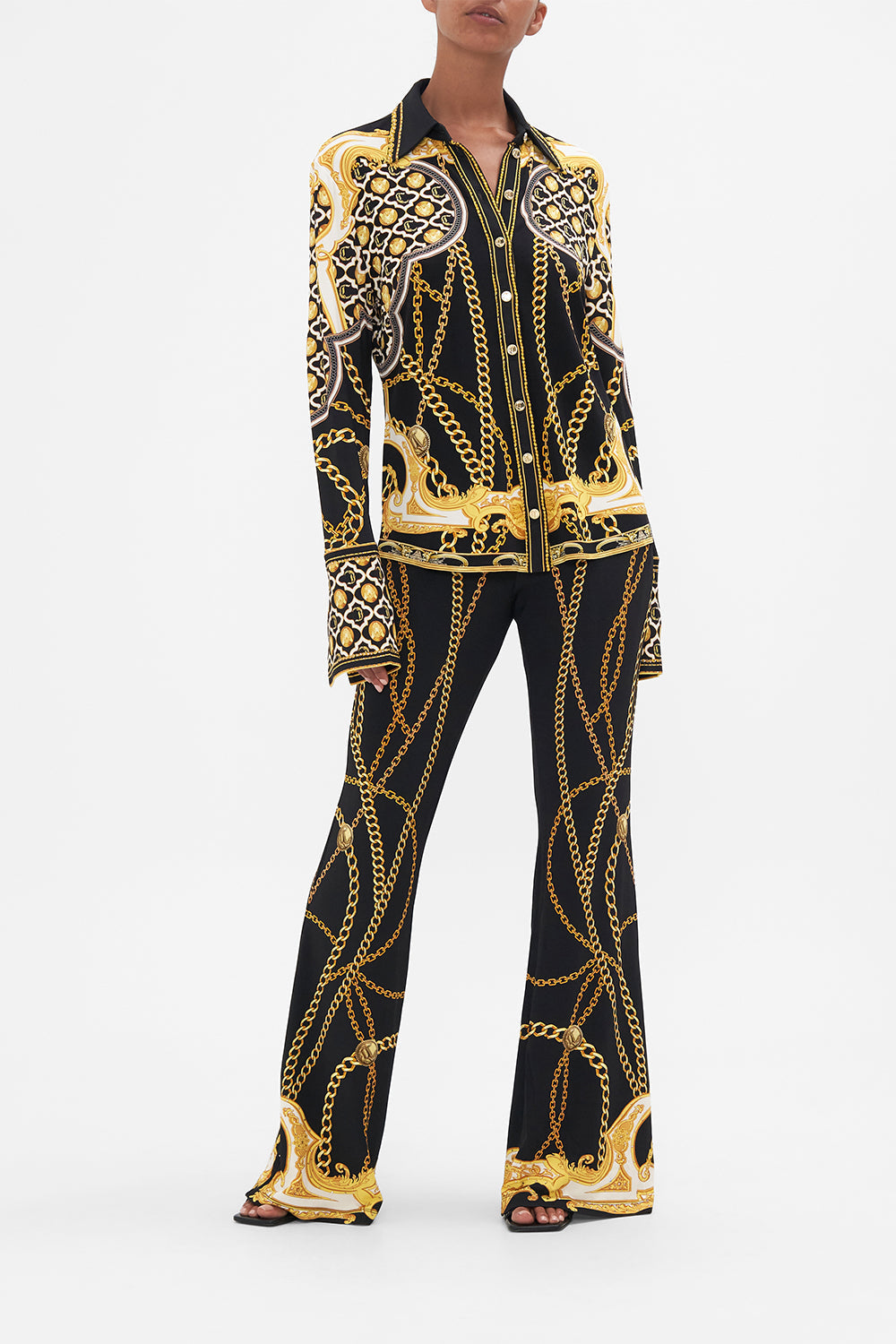 Front view of model wearing CAMILLA black jersey shirt in Tether Me Not print