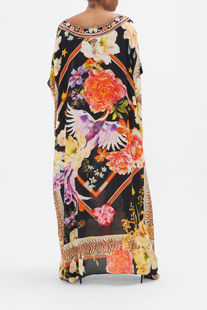 Back view of model wearing CAMILLA silk kaftan in Secret History floral print