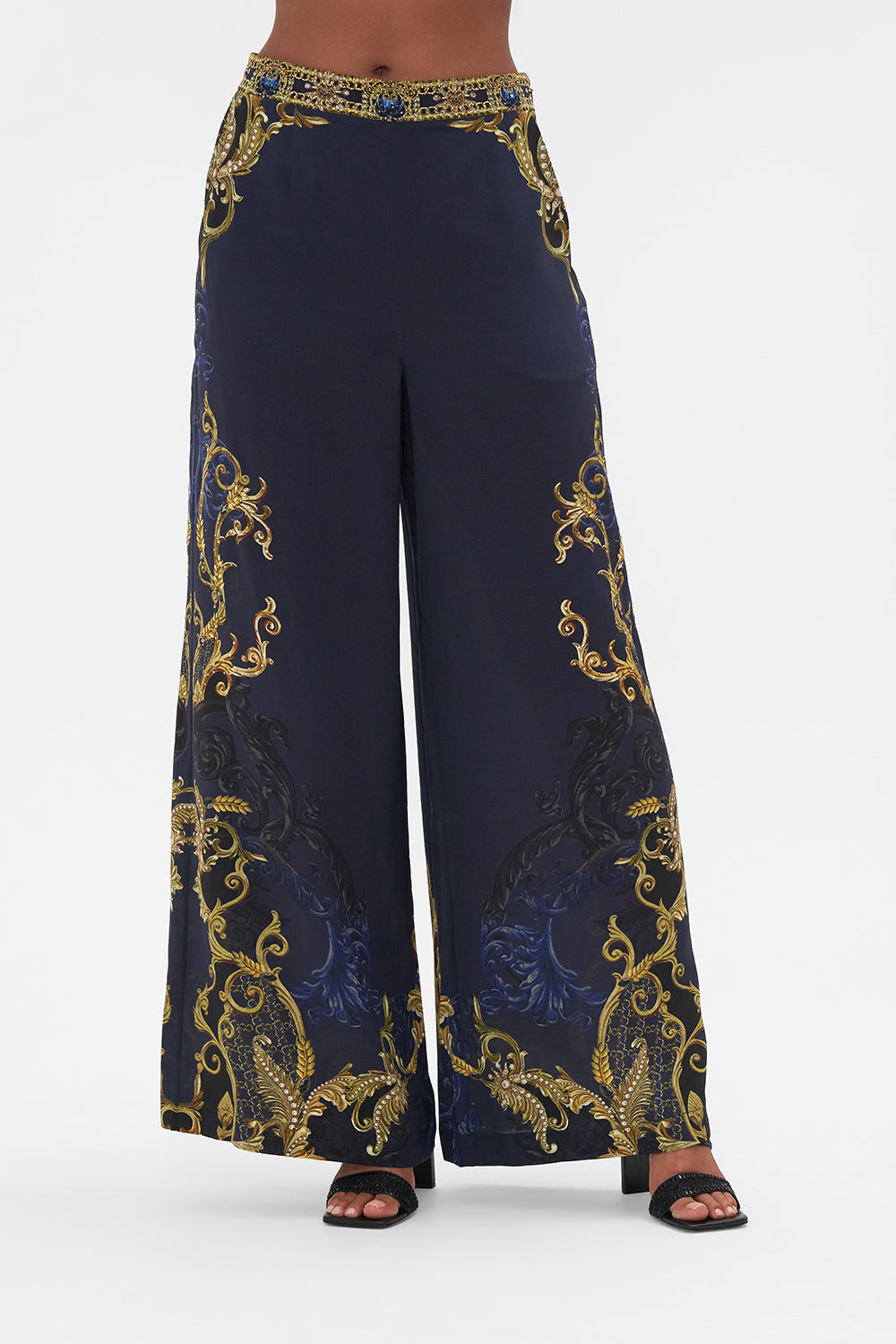 Crop view model wearing of CAMILLA silk pants in Moonlight Melodies print