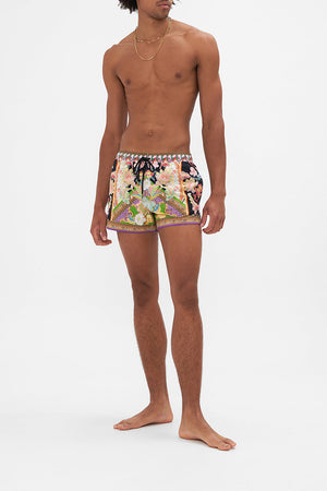 Front view of model wearing Hotel Franks by CAMILLA mens swim short in Sundowners In Sicily print