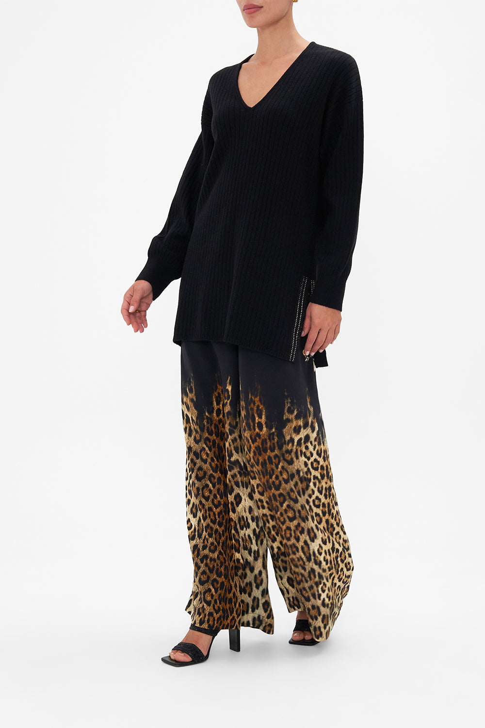 Side view of model wearing  CAMILLA black v neck wool cashmere knit jumper in Lions Mane print