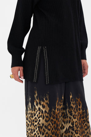 Crop view of model wearing  CAMILLA black v neck wool cashmere knit jumper in Lions Mane print