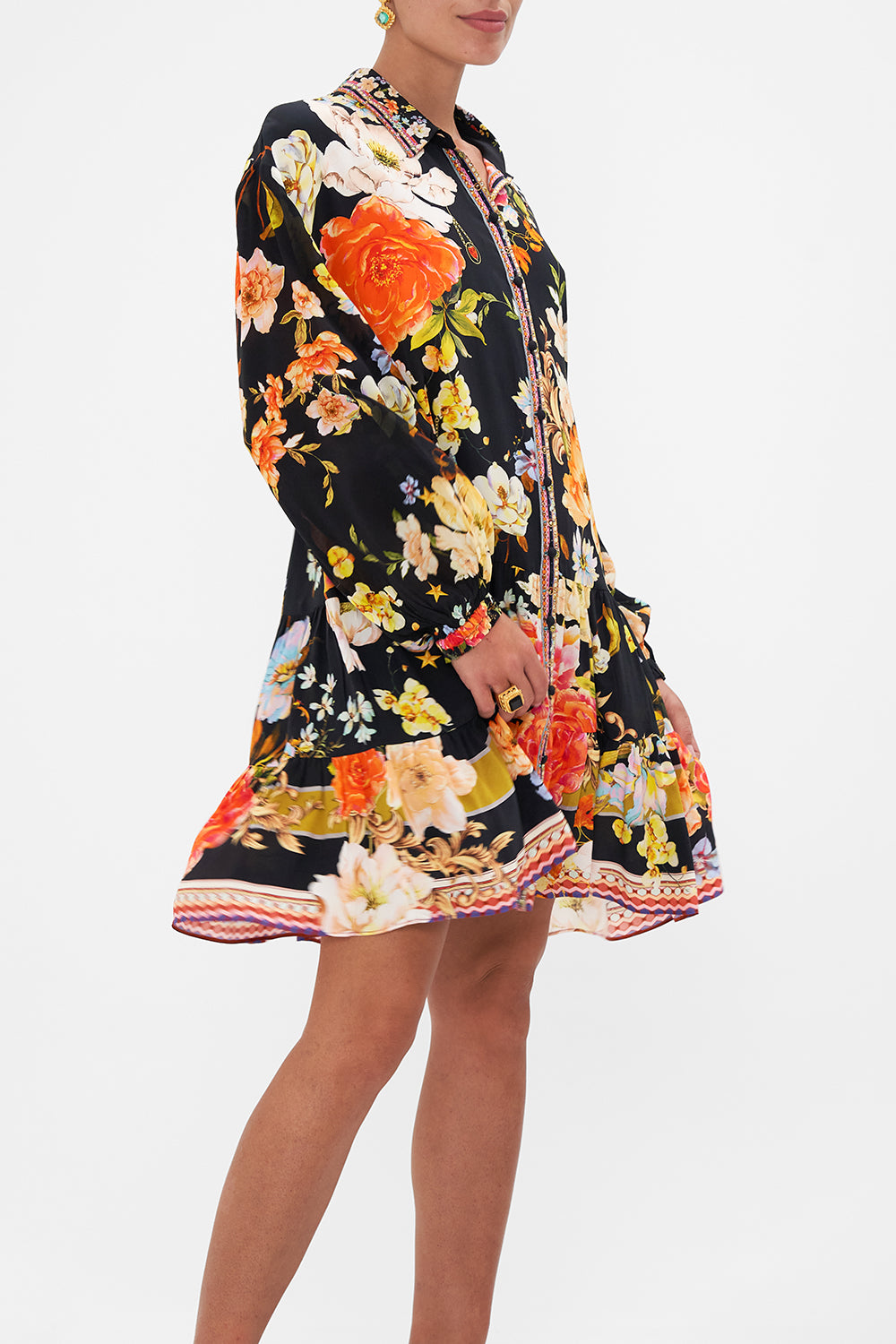 Crop view of model wearing CAMILLA floral silk shirdress in Secret History print 