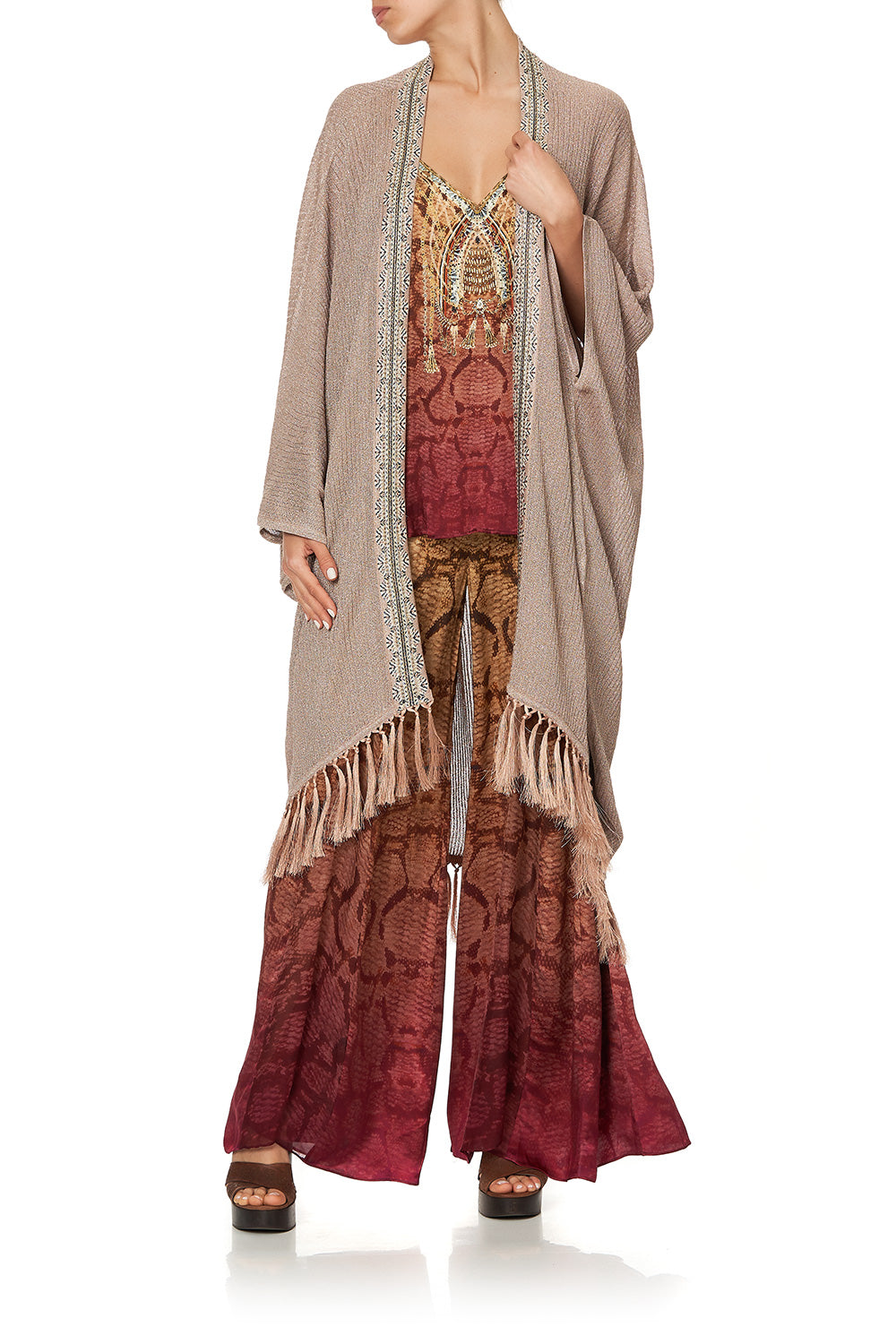 METALLIC KNIT PONCHO WITH TASSELS COASTAL TREASURE